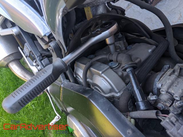 How to replace motorcycle spark plugs?